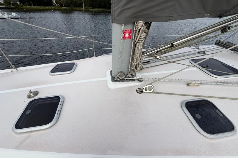 Slide: The Image of Deck of a 1998 Catalina 380 sailboat with hatches and rigging details. - 18