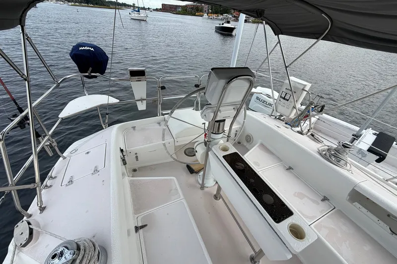 Slide: The Image of Cockpit view of a 1998 Catalina 380 sailboat, featuring steering and seating areas. - 6
