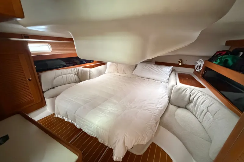 Slide: The Image of Cozy cabin interior of a 1998 Catalina 380 sailboat with a comfortable bed. - 29
