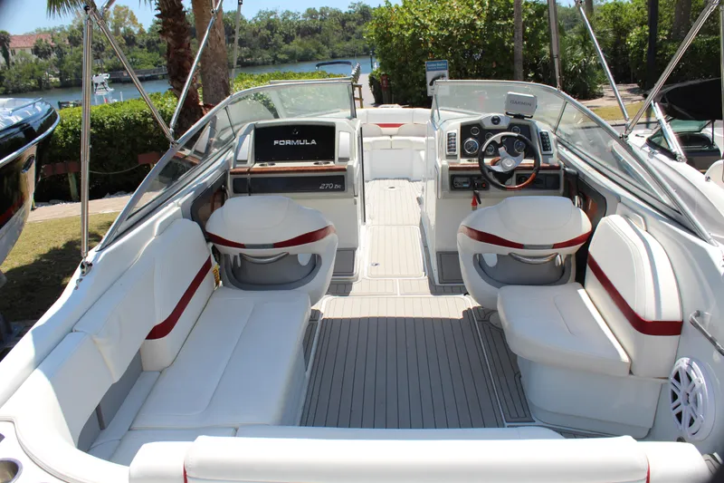 Slide: The Image of 2011 Formula 270 Bowrider boat with spacious seating and modern dashboard. - 28