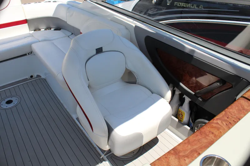 Slide: The Image of 2011 Formula 270 Bowrider boat interior with white seating and wood accents. - 38