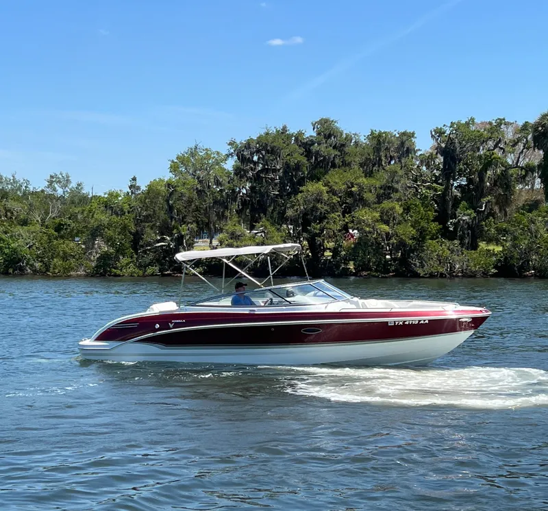 Slide: The Image of 2011 Formula 270 Bowrider cruising on a sunny day near a forested shoreline. - 5