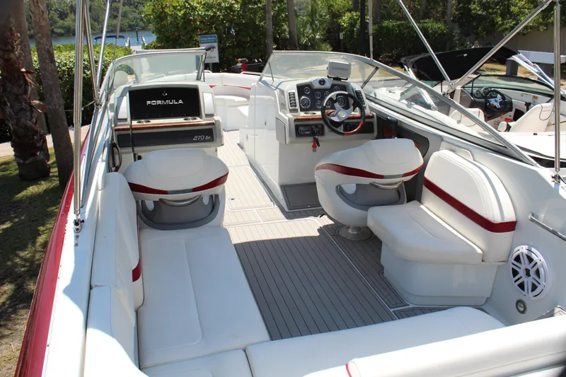 Slide: The Image of 2011 Formula 270 Bowrider boat with spacious seating and modern dashboard. - 29