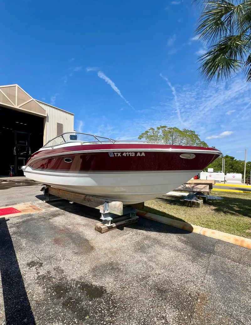 Slide: The Image of 2011 Formula 270 Bowrider boat on a trailer outside a storage facility. - 15