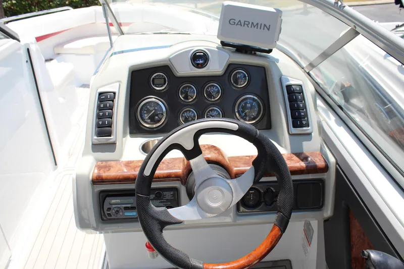 Slide: The Image of 2011 Formula 270 Bowrider dashboard with Garmin GPS and steering wheel. - 34