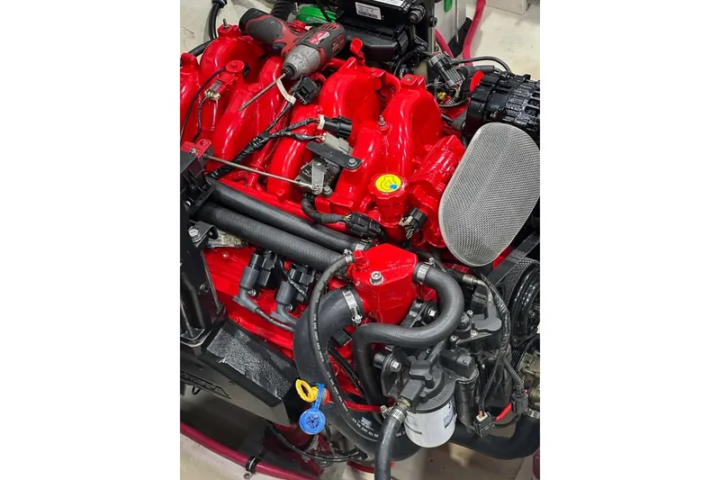 Slide: The Image of Engine of a 2011 Formula 270 Bowrider, featuring vibrant red components. - 44