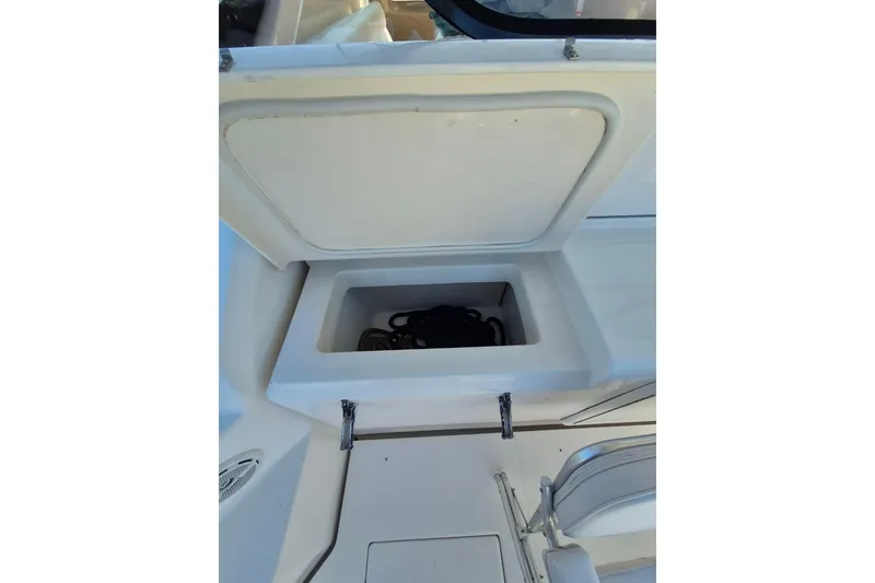 Slide: The Image of Open storage compartment on a 2004 Riviera 4000 Offshore boat. - 74