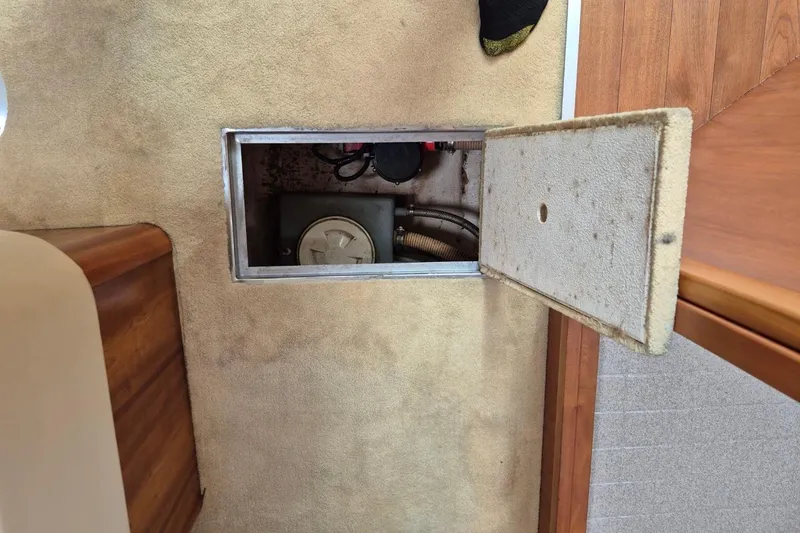 Slide: The Image of Open hatch on 2004 Riviera 4000 Offshore boat, revealing interior compartment. - 68