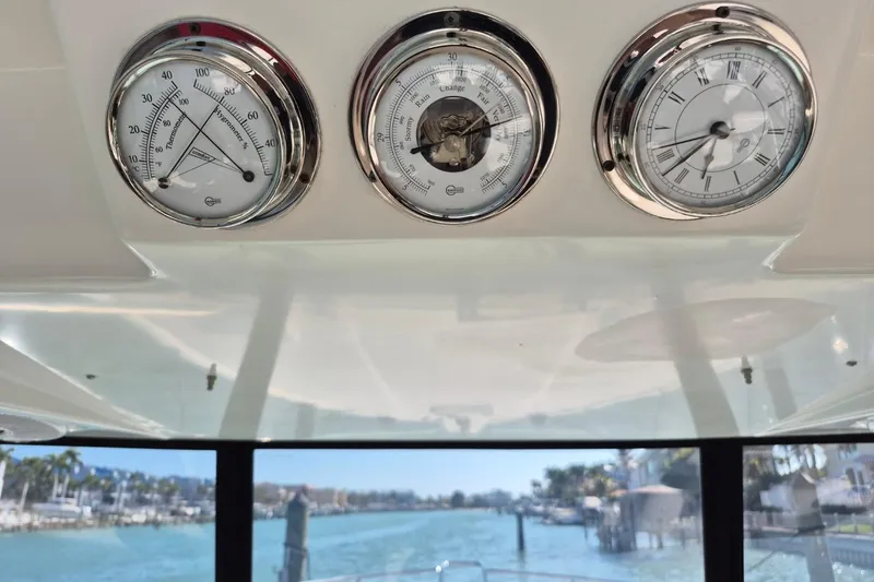 Slide: The Image of Gauges on 2004 Riviera 4000 Offshore boat with scenic waterfront view. - 50
