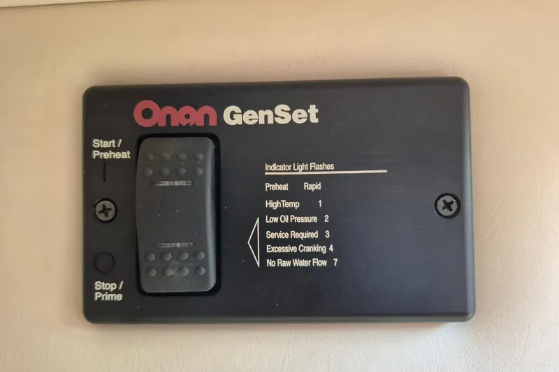 Slide: The Image of Onan GenSet control panel on 2004 Riviera 4000 Offshore boat. - 64