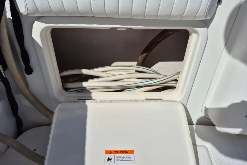 Slide: The Image of Storage compartment with cables on a 2004 Riviera 4000 Offshore boat. - 14