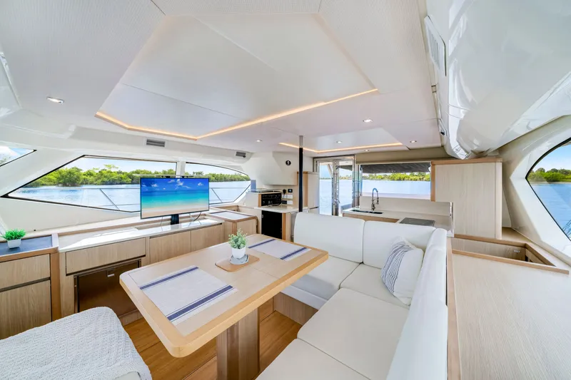 Slide: The Image of Luxurious interior of 2019 Aquila 44 Yacht with modern furnishings and scenic water views. - 49