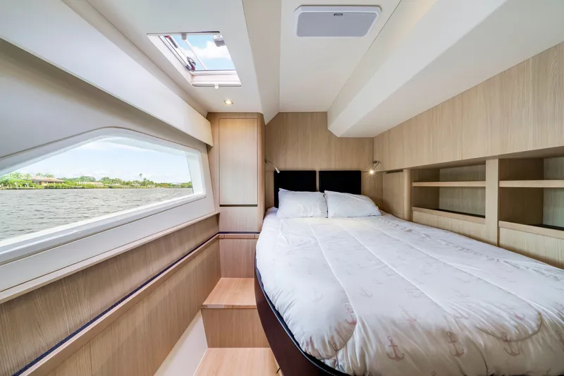 Slide: The Image of Luxurious bedroom interior of 2019 Aquila 44 Yacht with scenic window view. - 59