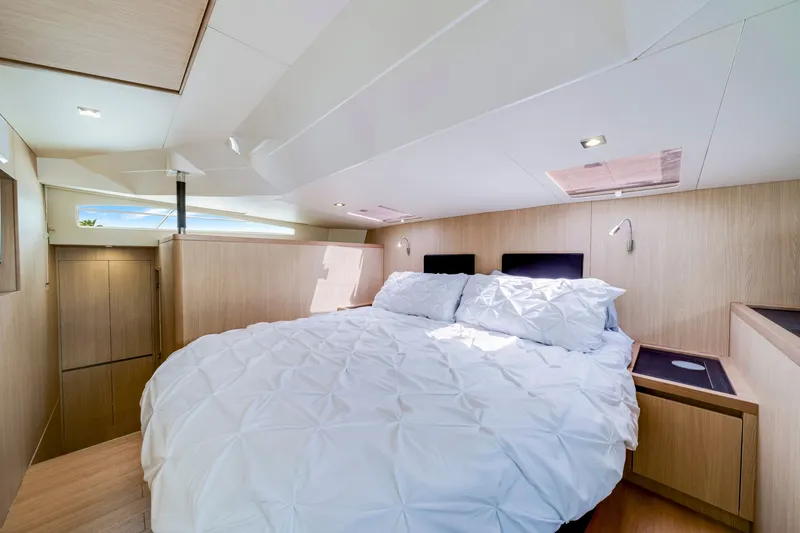 Slide: The Image of Luxurious bedroom interior of 2019 Aquila 44 Yacht with modern design and natural lighting. - 51