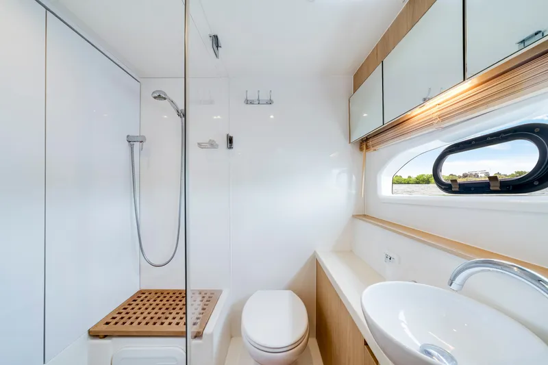 Slide: The Image of Luxurious bathroom interior of 2019 Aquila 44 Yacht with modern fixtures and ocean view. - 61