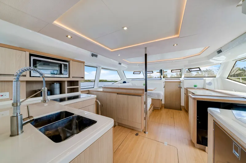 Slide: The Image of Luxurious interior of 2019 Aquila 44 Yacht with modern kitchen and panoramic windows. - 41