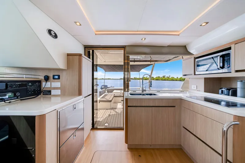 Slide: The Image of Modern kitchen interior of 2019 Aquila 44 Yacht with sleek cabinetry and scenic water view. - 36