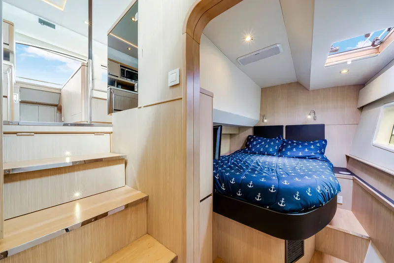 Slide: The Image of Luxurious interior of 2019 Aquila 44 Yacht featuring cozy bedroom and modern staircase. - 62