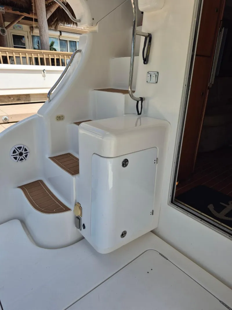 Slide: The Image of 2002 Silverton 38 Convertible boat interior stairs and storage compartment. - 22