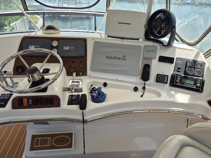 Slide: The Image of Helm of 2002 Silverton 38 Convertible with Garmin navigation and control instruments. - 14