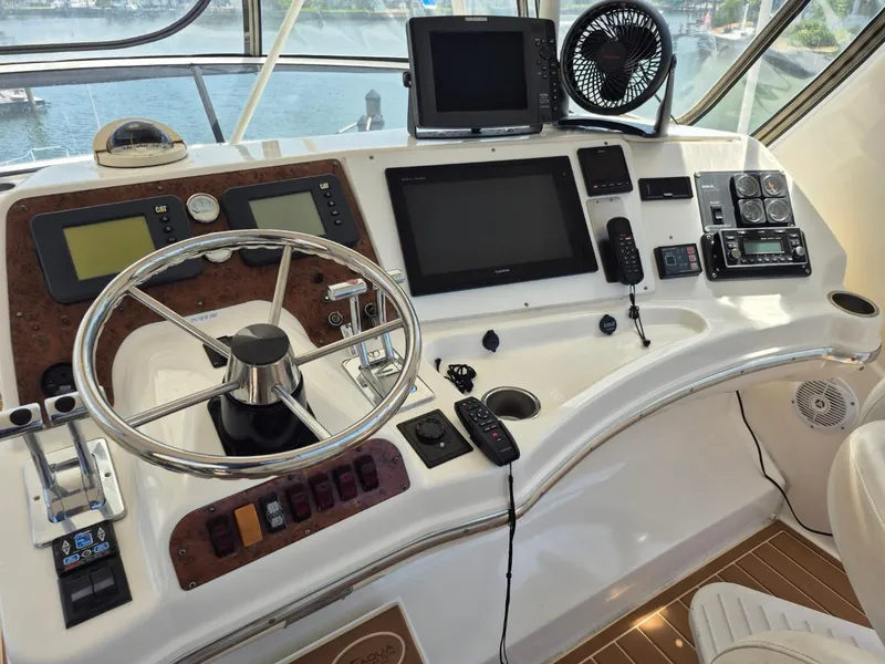 Slide: The Image of Control panel of a 2002 Silverton 38 Convertible yacht with navigation equipment. - 10