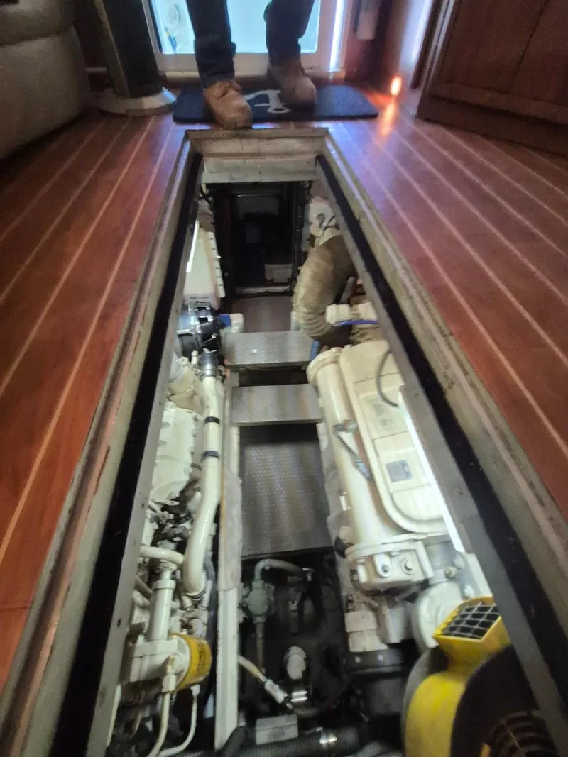 Slide: The Image of Engine room of a 2002 Silverton 38 Convertible yacht with visible machinery. - 45