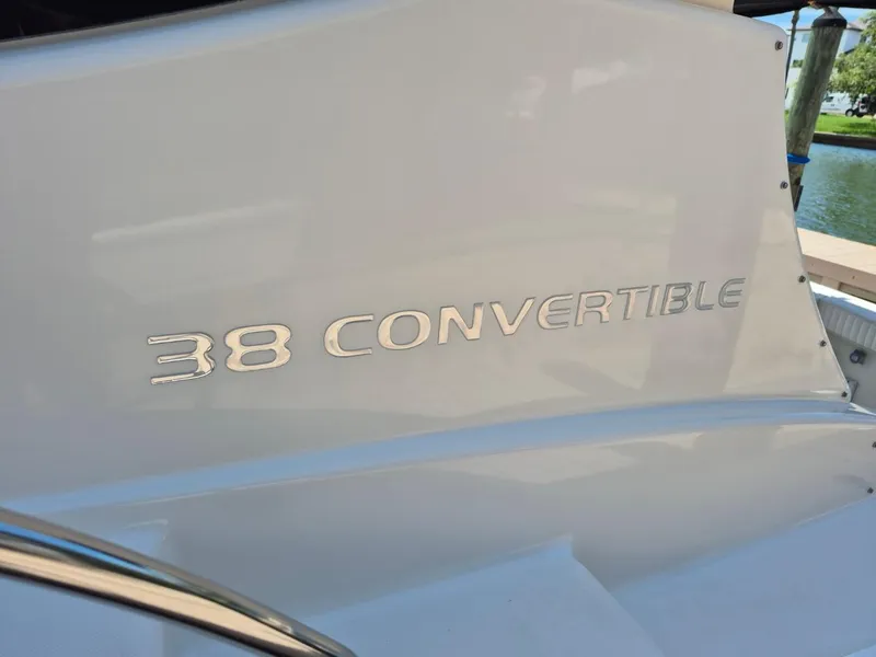Slide: The Image of 2002 Silverton 38 Convertible boat nameplate in sleek metallic lettering. - 6
