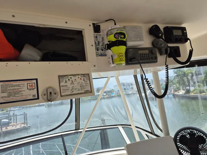 Slide: The Image of Interior view of a 2002 Silverton 38 Convertible boat with communication equipment. - 16