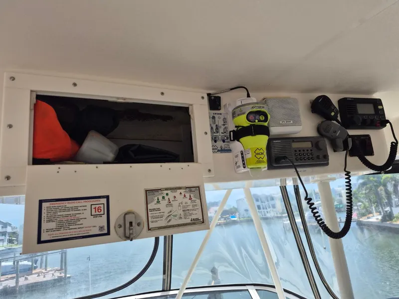 Slide: The Image of Interior view of a 2002 Silverton 38 Convertible boat with communication equipment. - 17