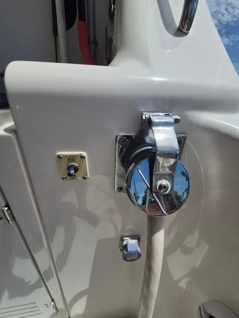 Slide: The Image of Close-up of a 2002 Silverton 38 Convertible boat's deck fittings and controls. - 24