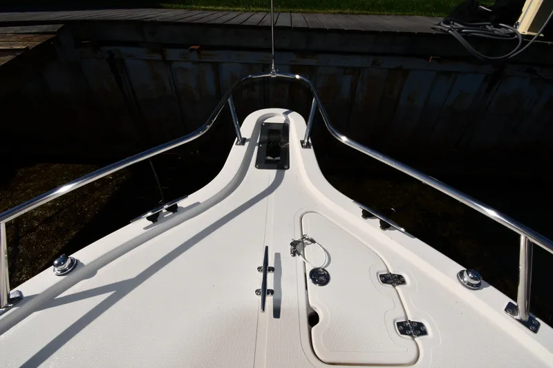 Slide: The Image of Bow view of 2004 Pursuit 2670 Denali LS boat docked at a marina. - 4