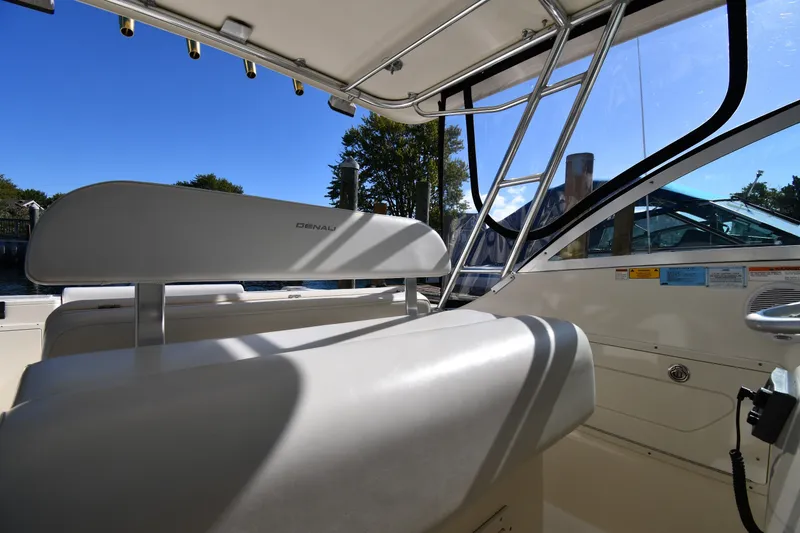 Slide: The Image of Interior view of 2004 Pursuit 2670 Denali LS boat with seating and railing. - 15