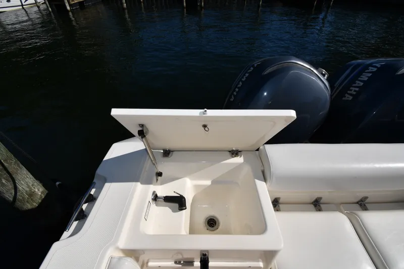 Slide: The Image of 2004 Pursuit 2670 Denali LS boat with open sink and Yamaha engines. - 20
