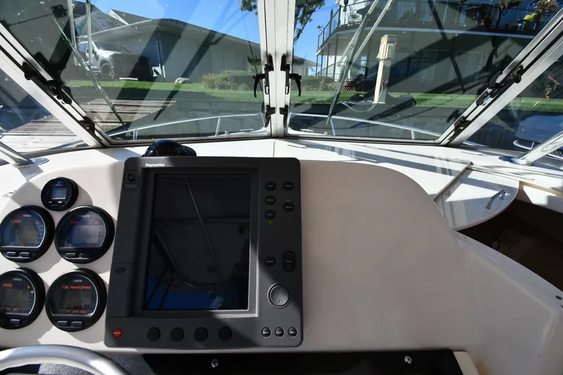 Slide: The Image of Dashboard of a 2004 Pursuit 2670 Denali LS boat with navigation instruments. - 10