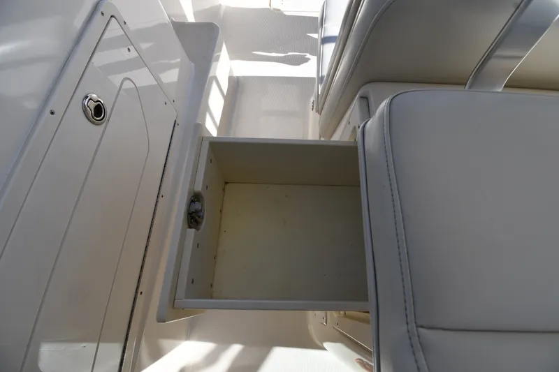 Slide: The Image of Open storage drawer on 2004 Pursuit 2670 Denali LS boat interior. - 24