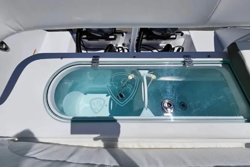 Slide: The Image of 2022 Century 2900 Center Console boat with a glass-covered compartment. - 11