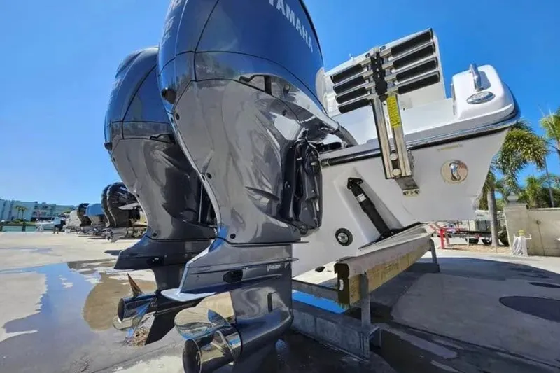 Slide: The Image of 2022 Century 2900 Center Console boat with dual Yamaha outboard engines. - 12