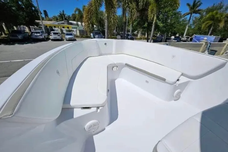 Slide: The Image of 2022 Century 2900 Center Console boat interior with white seating and spacious deck. - 4