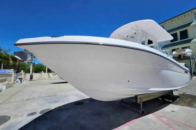 Slide: The Image of 2022 Century 2900 Center Console boat displayed outdoors on a sunny day. - 3