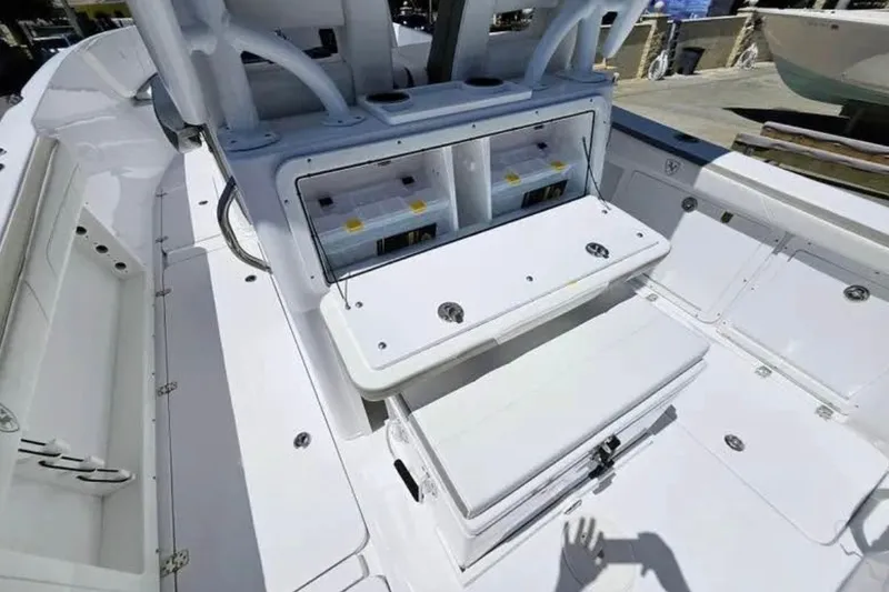 Slide: The Image of 2022 Century 2900 Center Console boat interior with storage compartments and seating. - 10