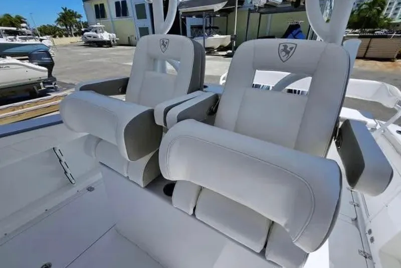 Slide: The Image of 2022 Century 2900 Center Console boat with luxurious white seating. - 9