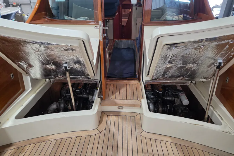 Slide: The Image of Hinckley Talaria 44 yacht engine compartments open, showcasing 2009 model's interior details. - 16