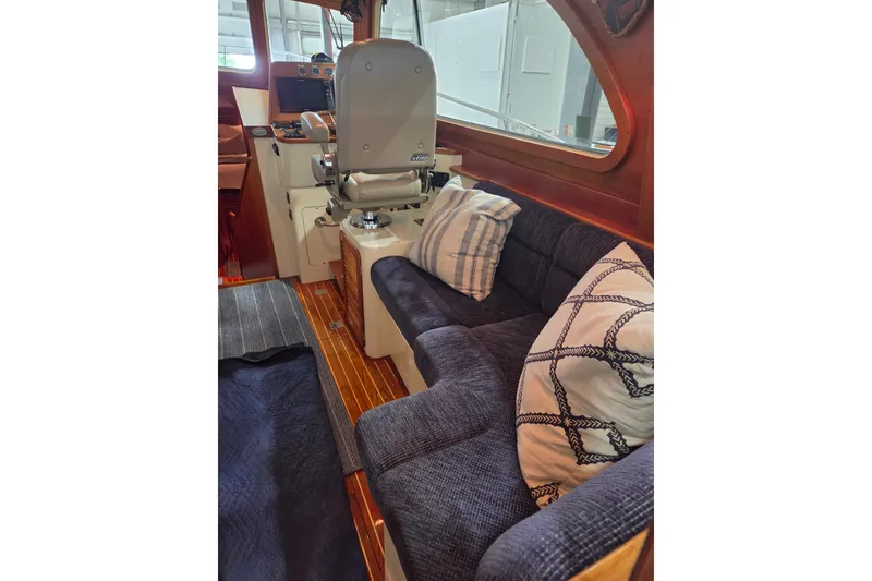 Slide: The Image of Interior of 2009 Hinckley Talaria 44 yacht with plush seating and helm station. - 8