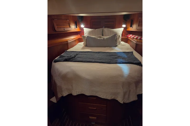 Slide: The Image of Luxurious cabin interior of 2009 Hinckley Talaria 44 yacht with cozy bedding. - 12