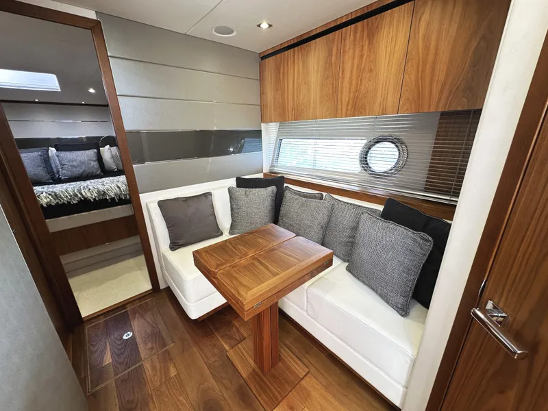 Slide: The Image of Luxurious interior of 2019 Sunseeker Predator 57 yacht with elegant seating and wooden finishes. - 39