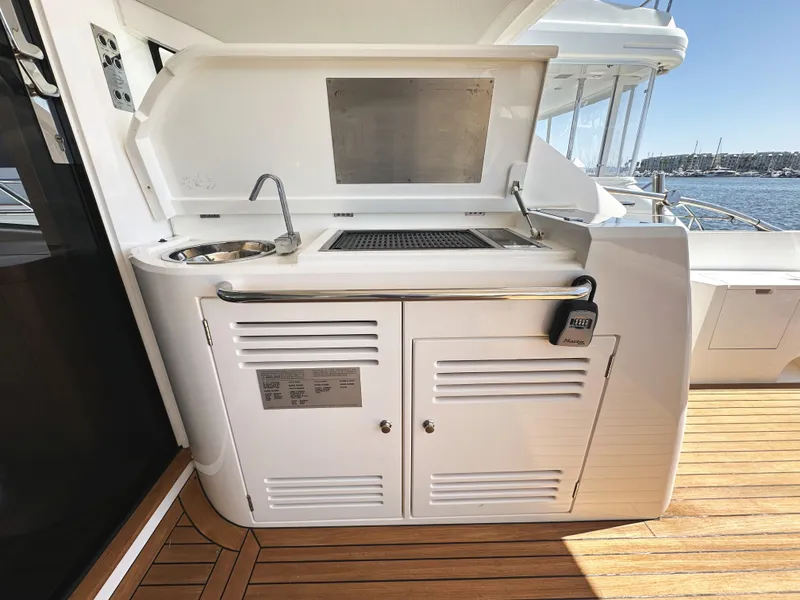 Slide: The Image of Outdoor kitchenette on 2019 Sunseeker Predator 57 yacht with sink and grill. - 13