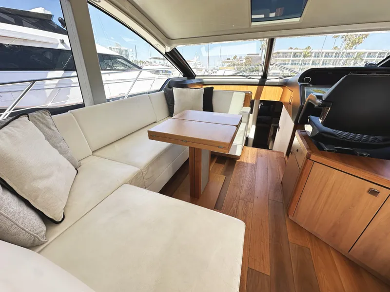 Slide: The Image of Luxurious interior of 2019 Sunseeker Predator 57 yacht with elegant seating and wooden flooring. - 20