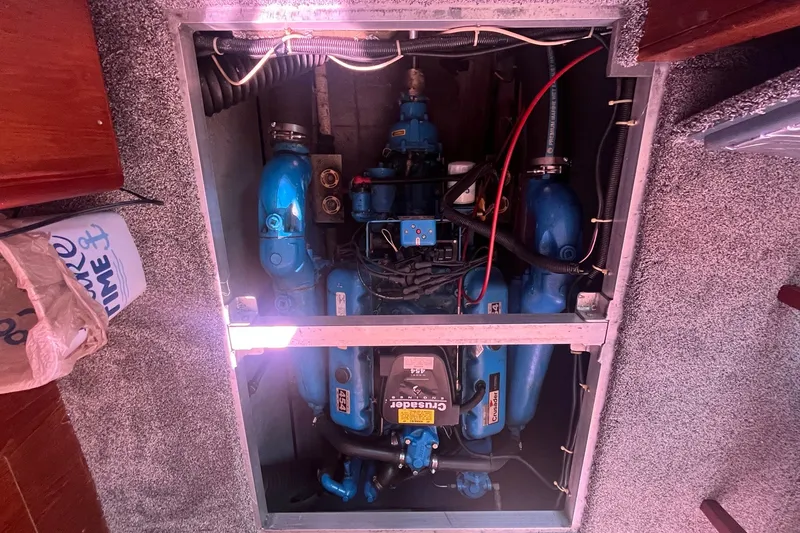 Slide: The Image of Engine compartment of a 1992 Carver 33 Aft Cabin Motor Yacht, featuring blue components. - 36