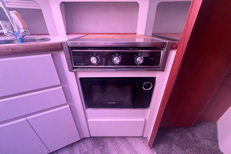 Slide: The Image of Kitchen area of 1992 Carver 33 Aft Cabin Motor Yacht with stove and microwave. - 27