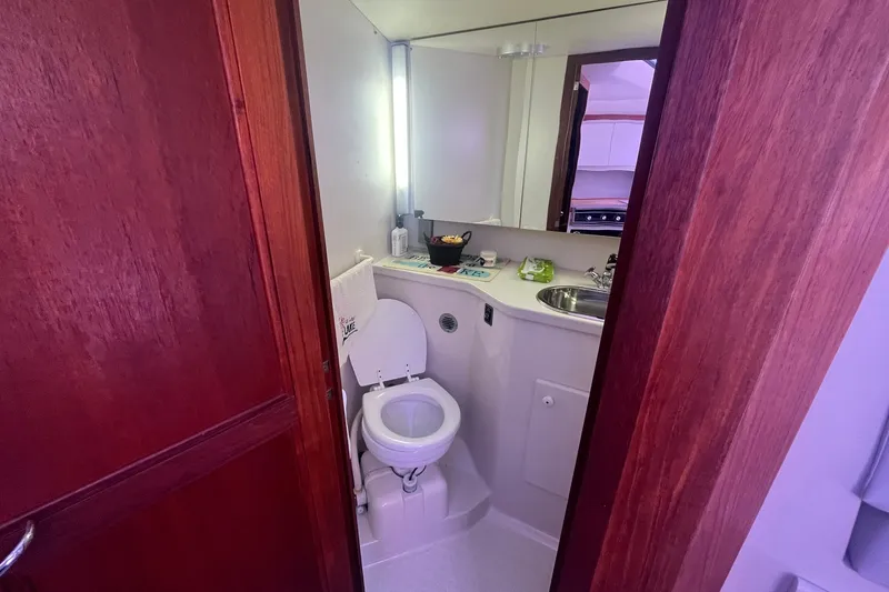 Slide: The Image of Bathroom interior of 1992 Carver 33 Aft Cabin Motor Yacht with toilet and sink. - 24